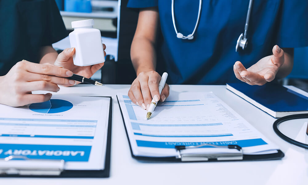 a doctor writing on a clipboard